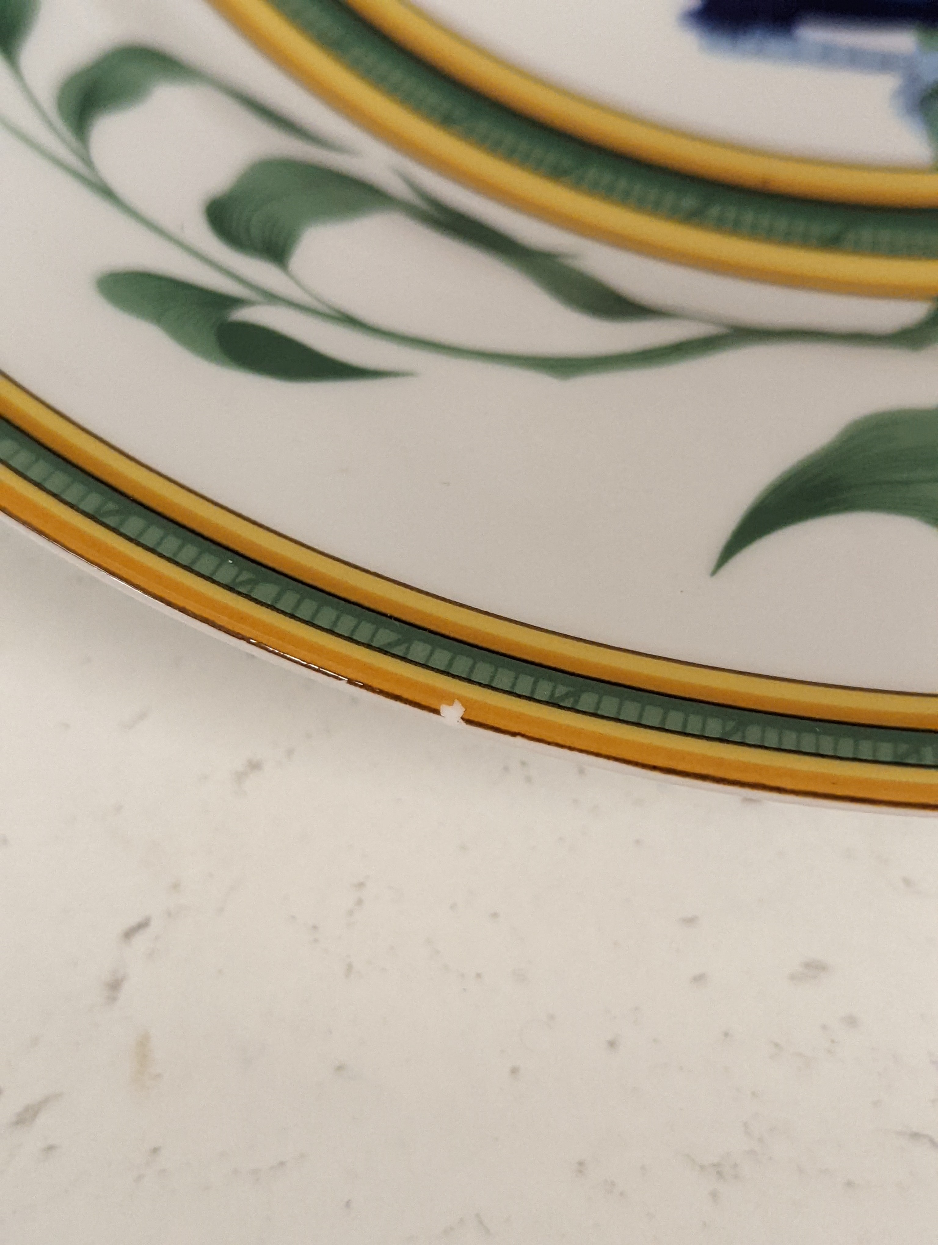 A pair of Hermes, Paris 'Toucan' plates, diameter 27.5cm, edge blemishes